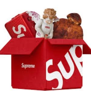 supreme mystery box filled with clothes and other supreme merchandise